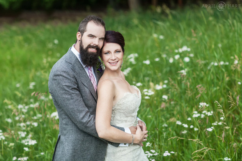 Summer wedding with wildflowers in the mountain meadow at The Pines at Genesee