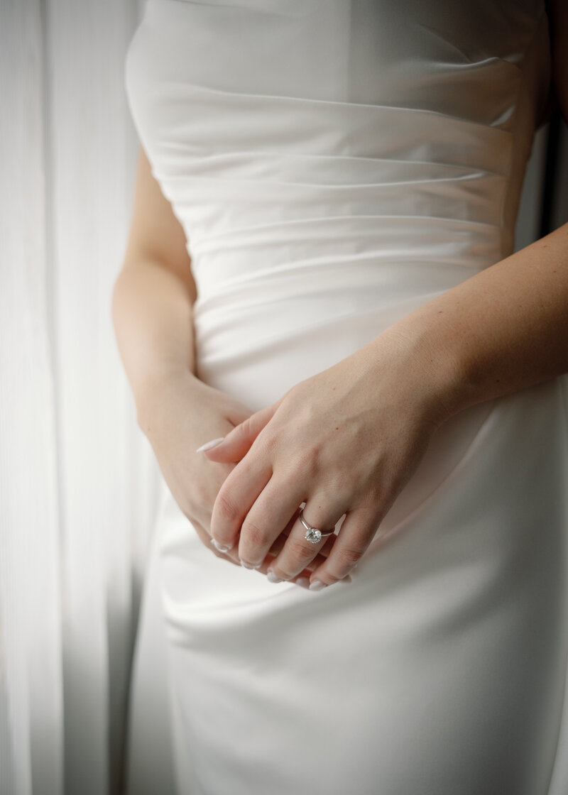 A bride has a quiet moment to herself as she gets ready to do a first look with her soon to be husband.