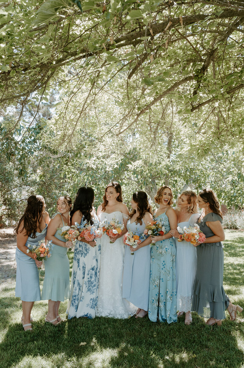 Bridesmaids wearing beautiful blue dresses