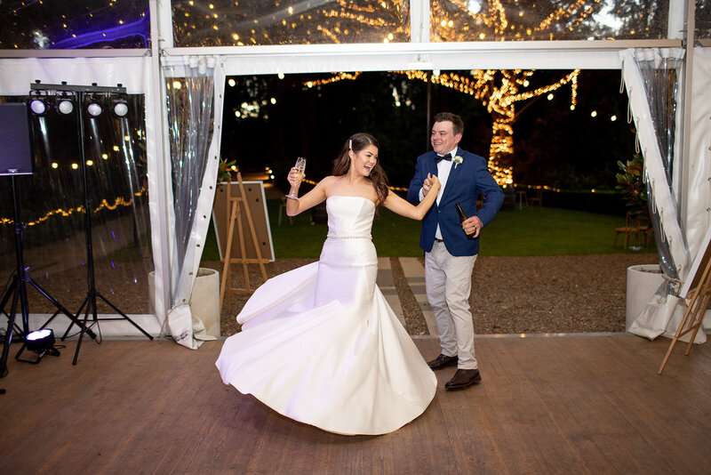 Wedding  couple dances while entering wedding reception