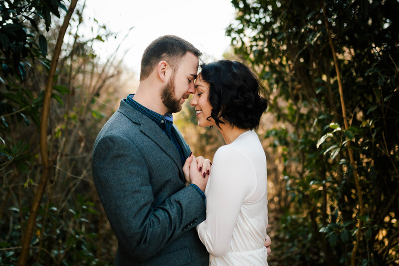 Luxury Wedding Portraits by Moving Mountains Photography in NC - Engagement photo of a couple facing each other.