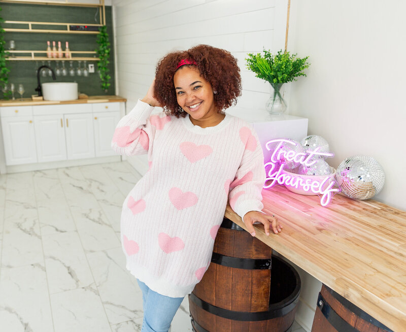 A-wedding-planner-poses-during-her-branding-photoshoot-in-her-wedding-venue-in-Baltimore