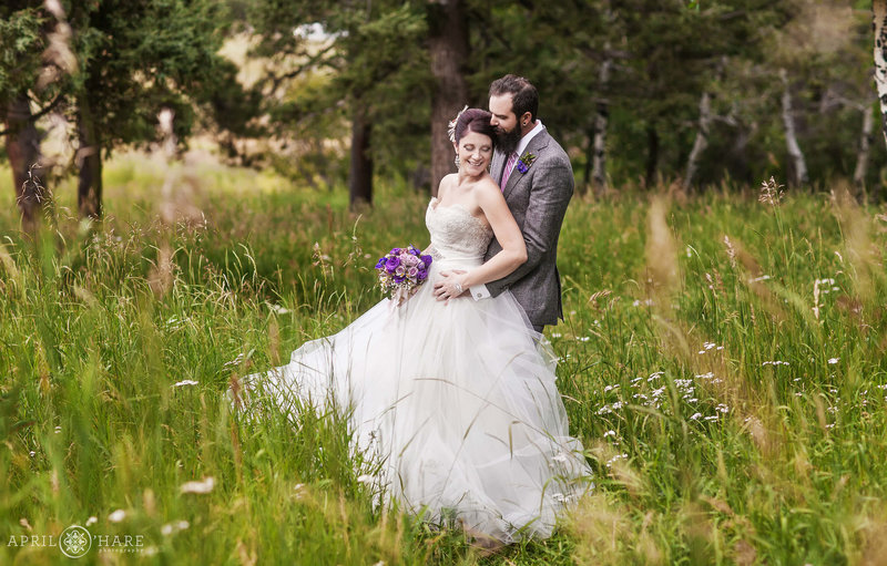 Gorgeous summer wedding portrait in the mountain meadow at Pines at Genesee
