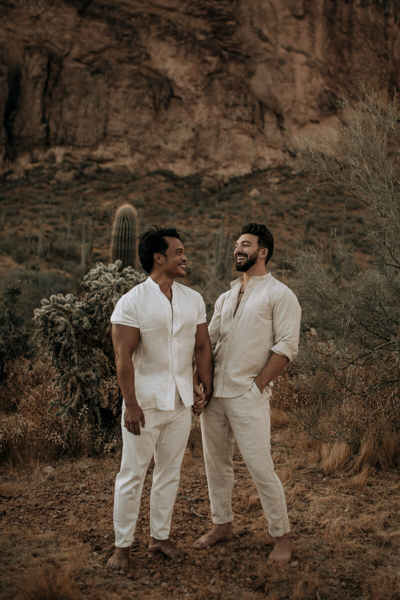 couple laughing in their engagement session photos in arizona lgbtq