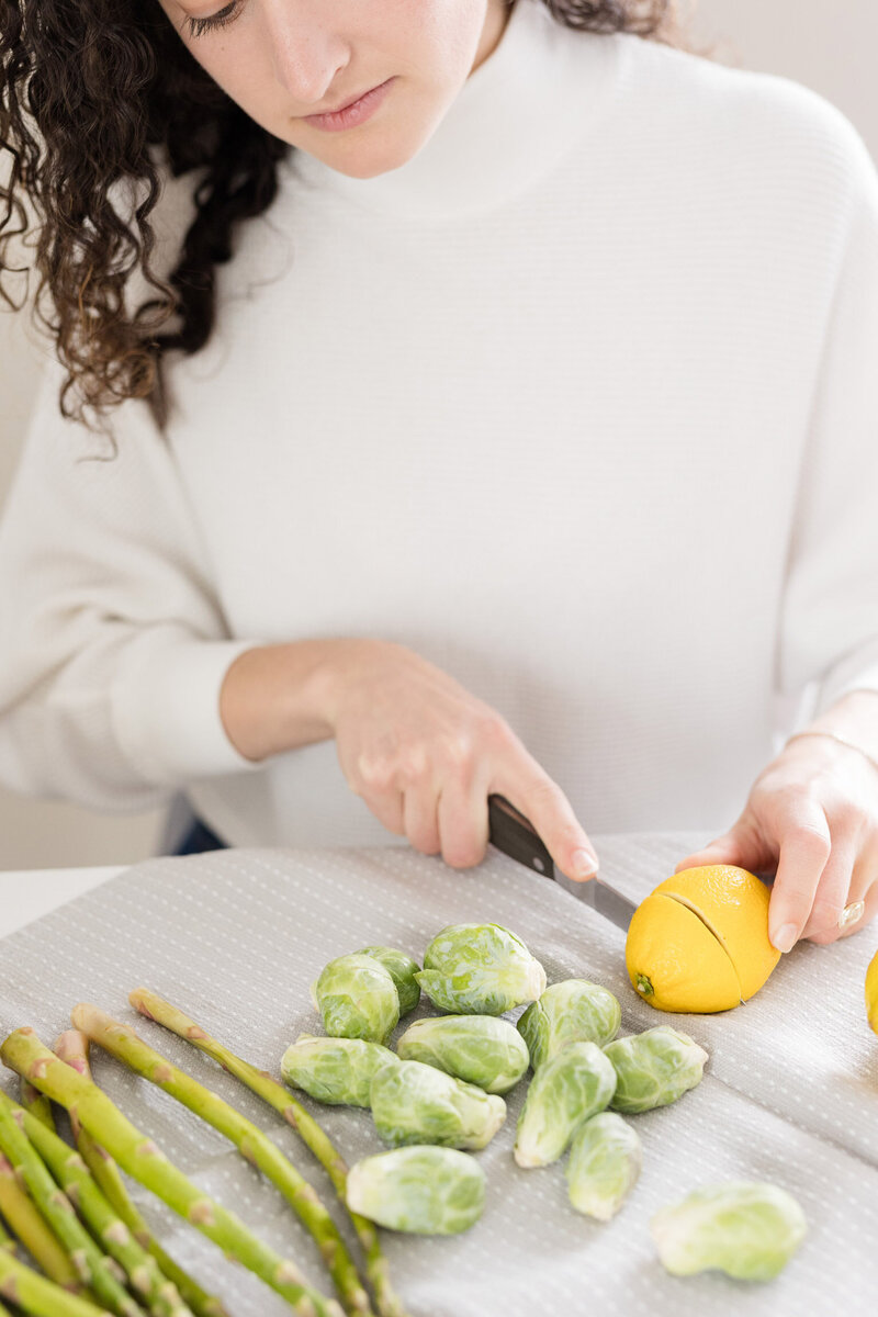 Grace cutting up vegetables