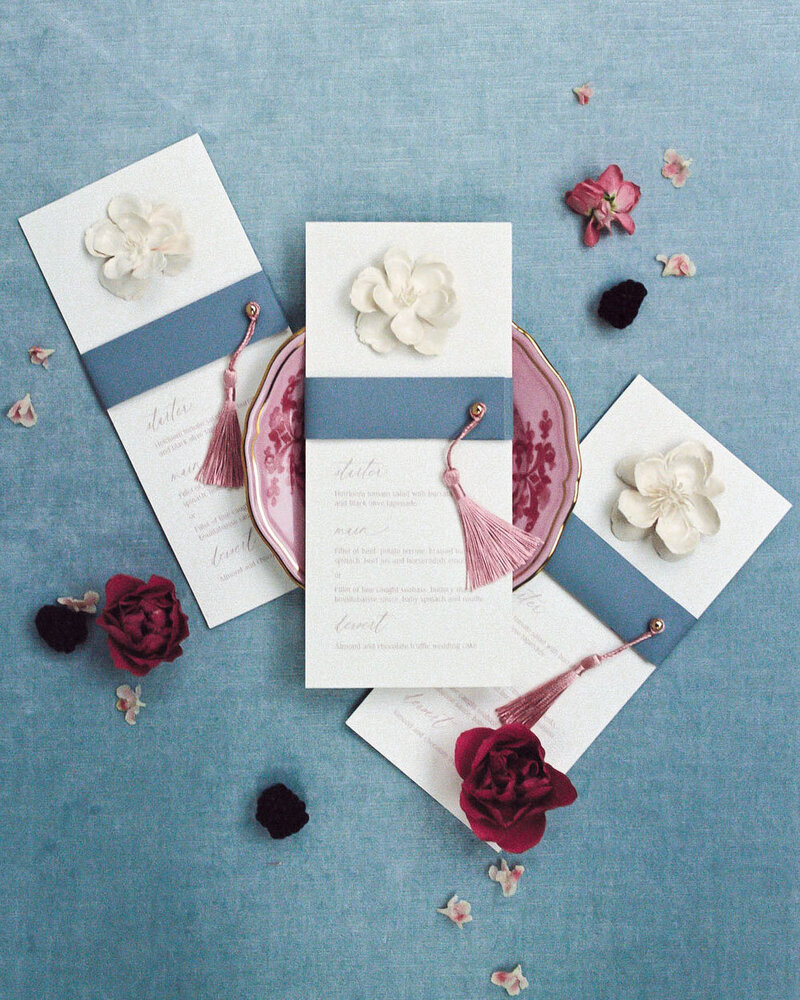 Dominique Alba Studio custom wedding stationery tassel and leather menus