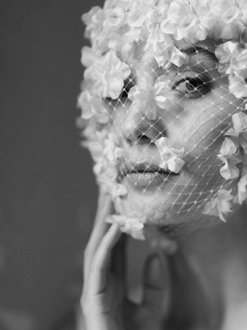 Bride wearing floral bridal mask