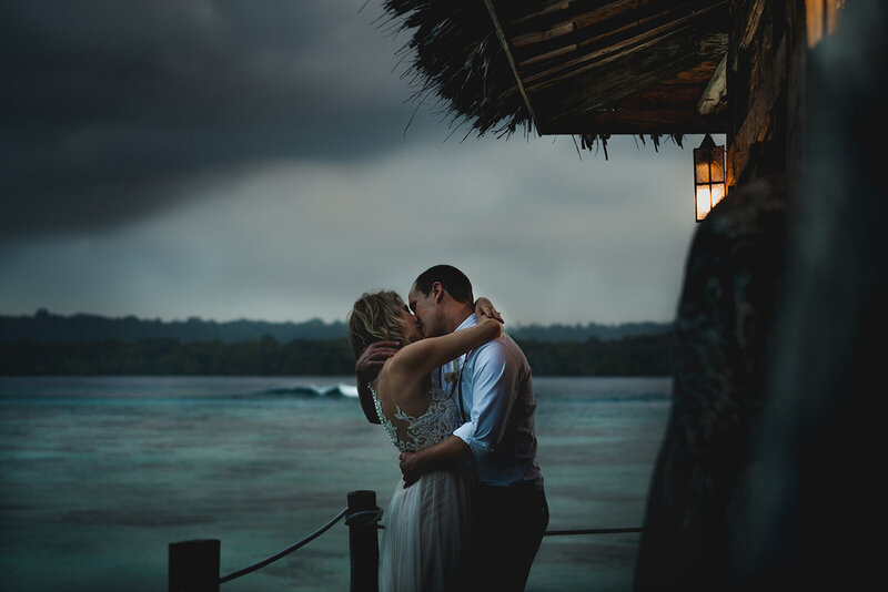 couple kissing in the sunset by the ocean in Vanuatu