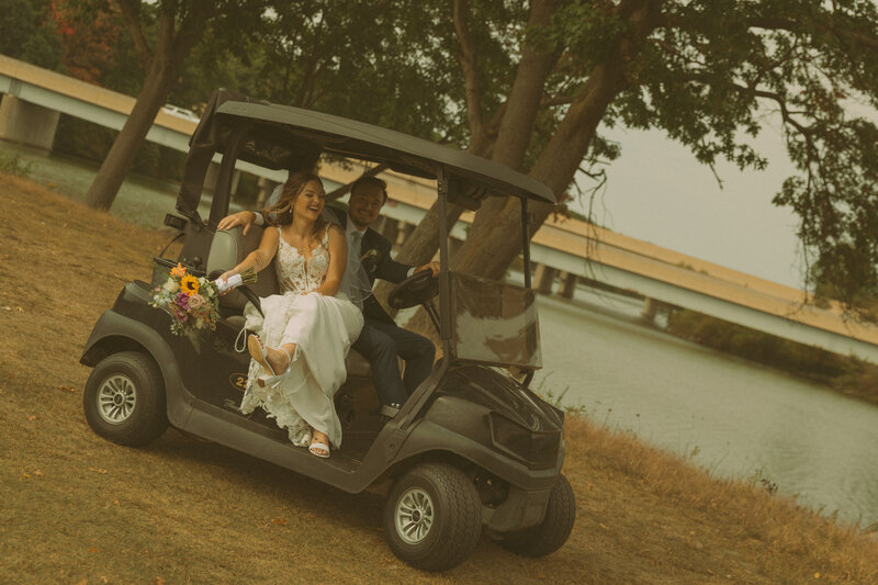The mother of the bride prepares the veil for the bride as the sun shines through a window, offering a beautiful backlight effect