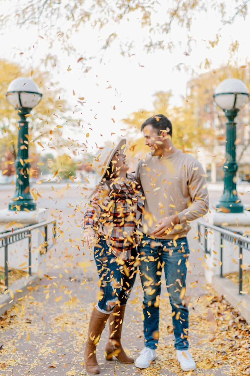 fall engagement photo in indiana with leaves