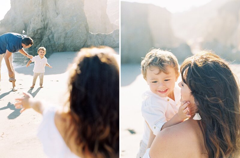 A little boy runs into his mom's arms on the beach while playing during their family photos