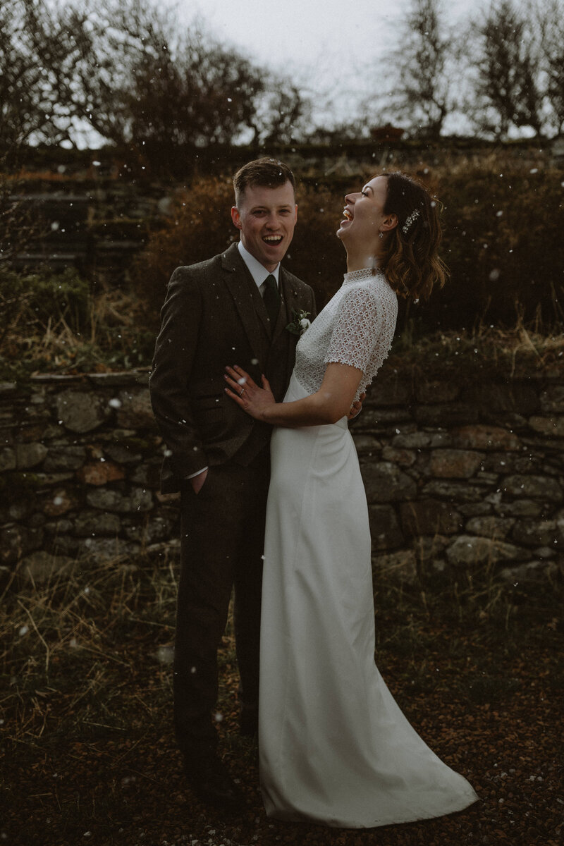 bride and groom in snow