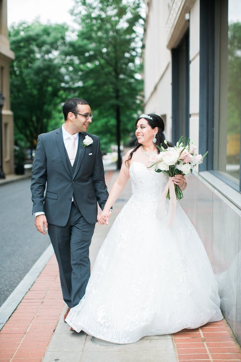 Wedding Photography, bride and groom walking down the street