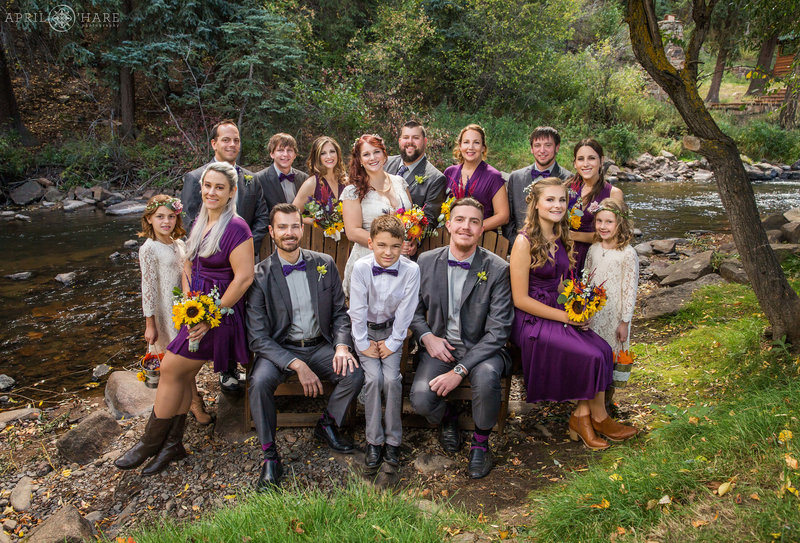 Wedding party photos next to Bear Creek at the Bear Creek Cabins during Autumn in Evergreen Colorado