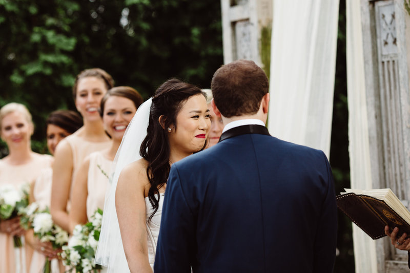 A couple enjoys a moment of laughter during a secular wedding ceremony at Terrain. The couple chose Lehigh Valley Celebrants for their wedding officiant.