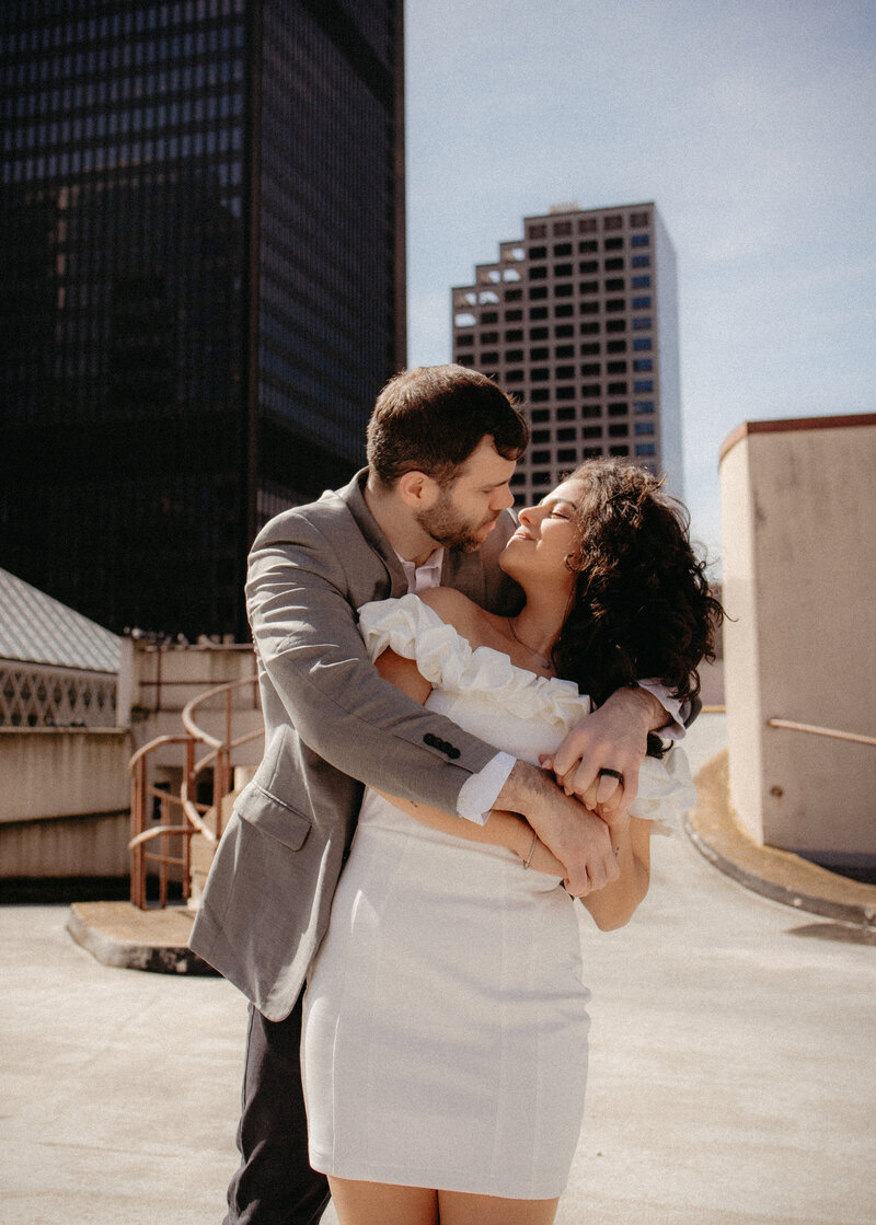 A candid moment of a champane pop, shared between an engaged couple captured by Washington wedding photographer, Lucia Muse.