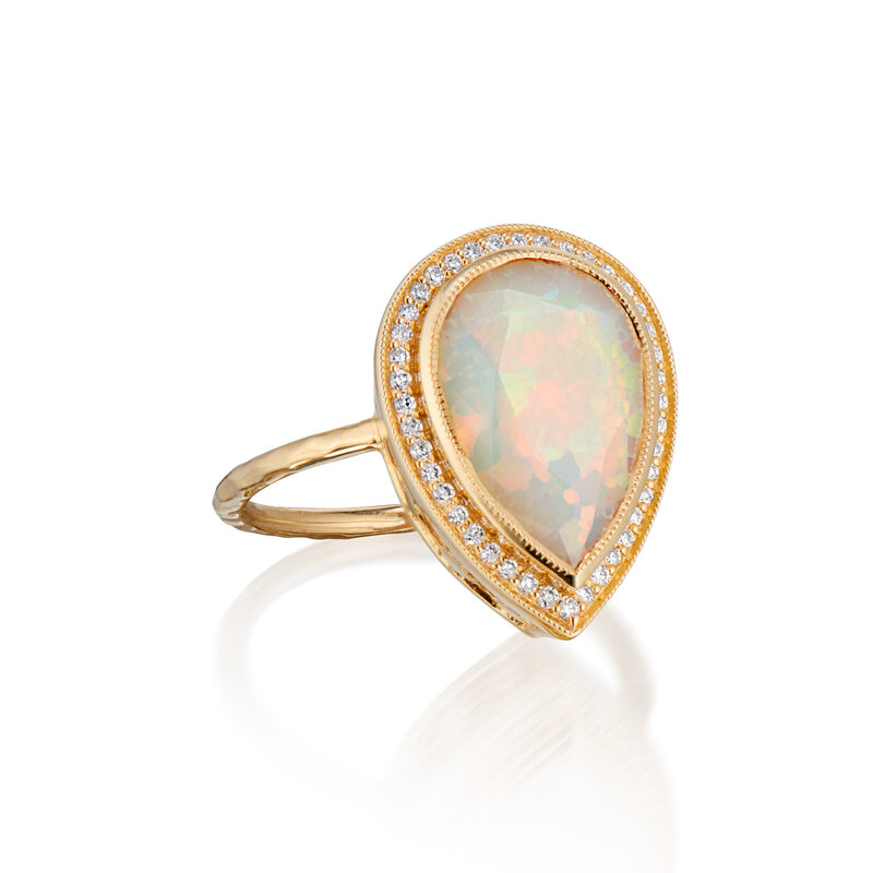 opal ring with stars in 14k gold basket
