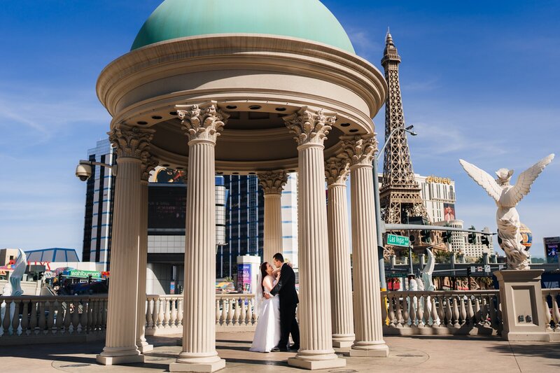 A couple dancing underneath a gazebo at the Las Vegas Strip during their elopement.