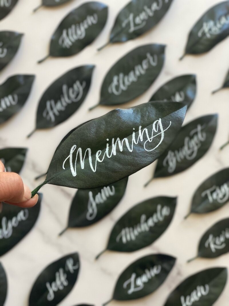 Leaf place cards with calligraphy names in white