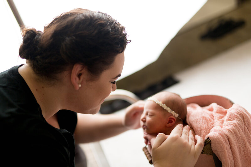 Newborn Photographer posing baby in studio