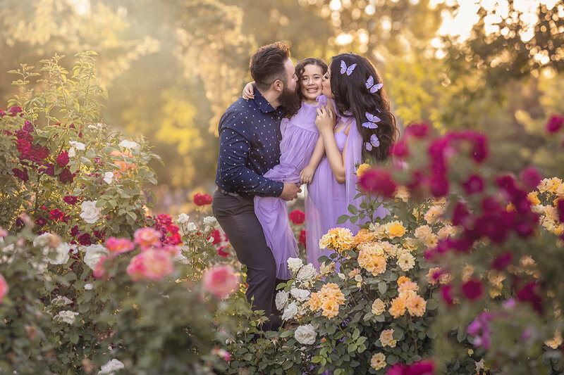 Maternity session at Roosevelt park in front of beautiful flowers