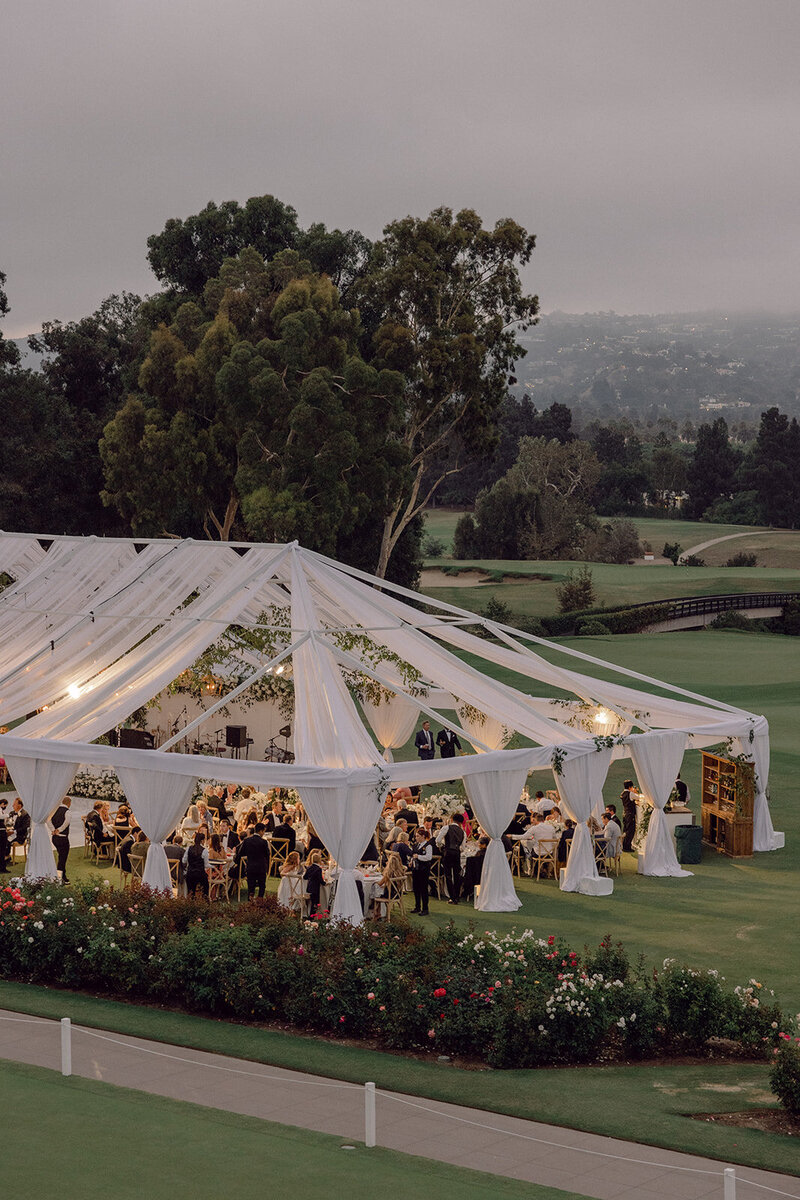 Outdoor luxury tented wedding photo taken at dusk