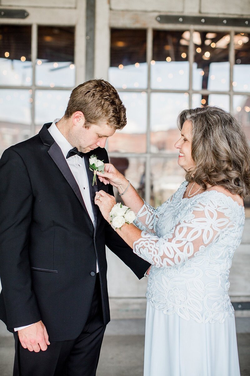 pinning on the boutonniere by Knoxville Wedding Photographer, Amanda May Photos