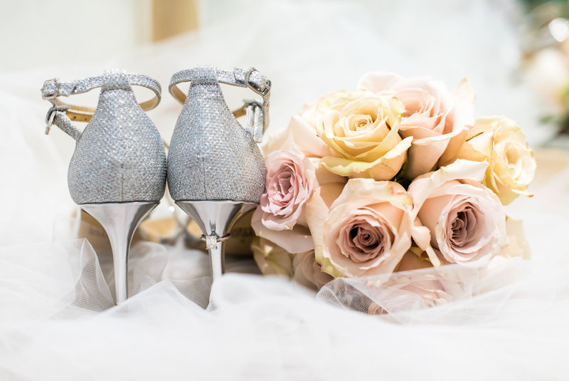 Silver shoes and pink and peach flowers