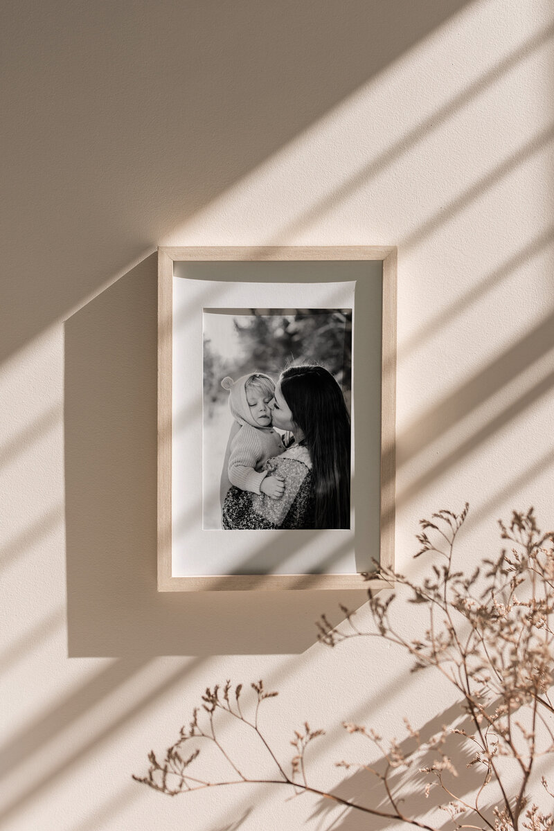 framed print of mom and her son