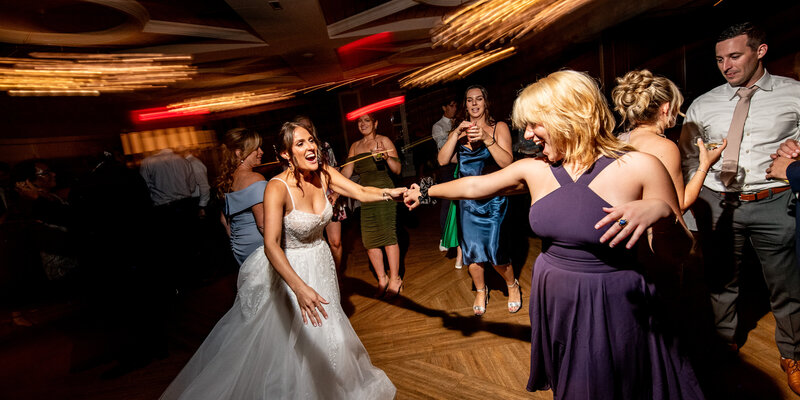 bride dancing wedding photographer
