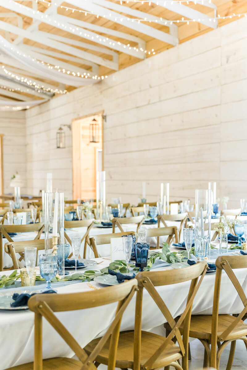 wedding reception with blue and greenery at koury farms