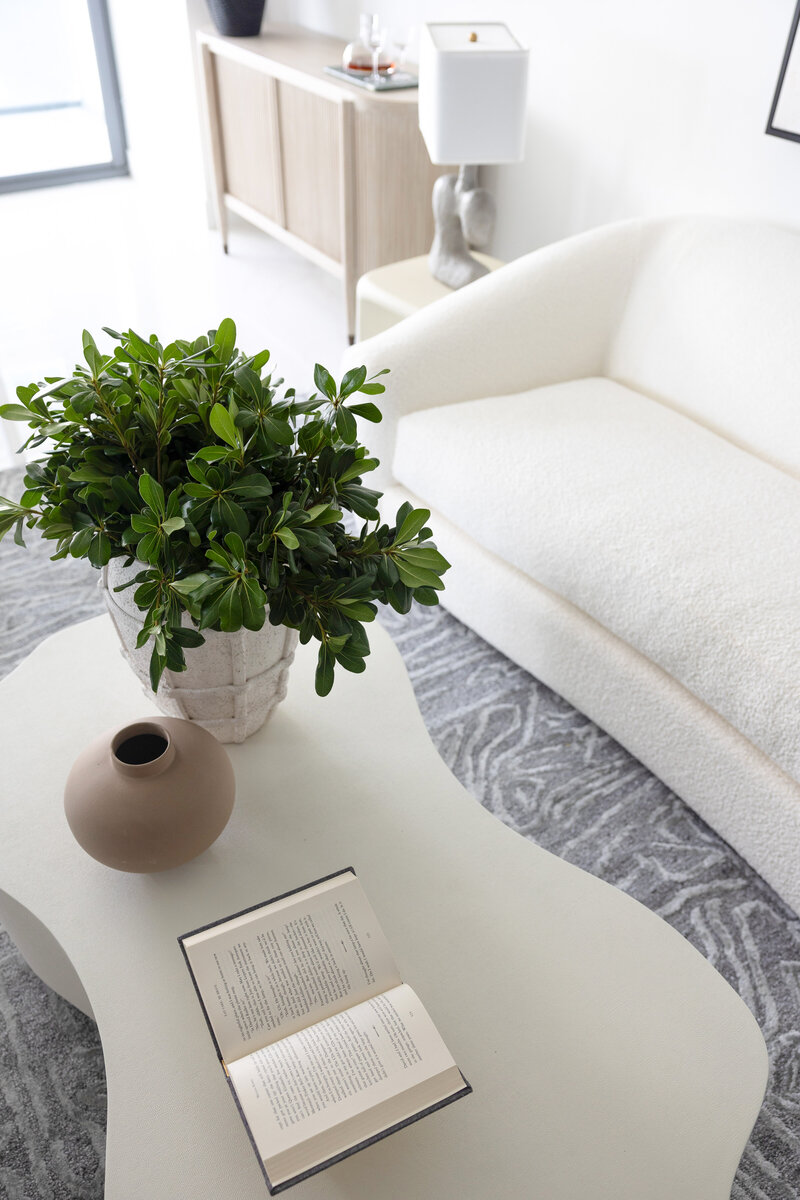 Miami florida living room limestone coffee table with greenery and vase decor