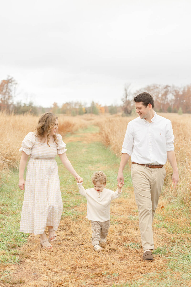 Family walking during photos in Prince William County, Virginia