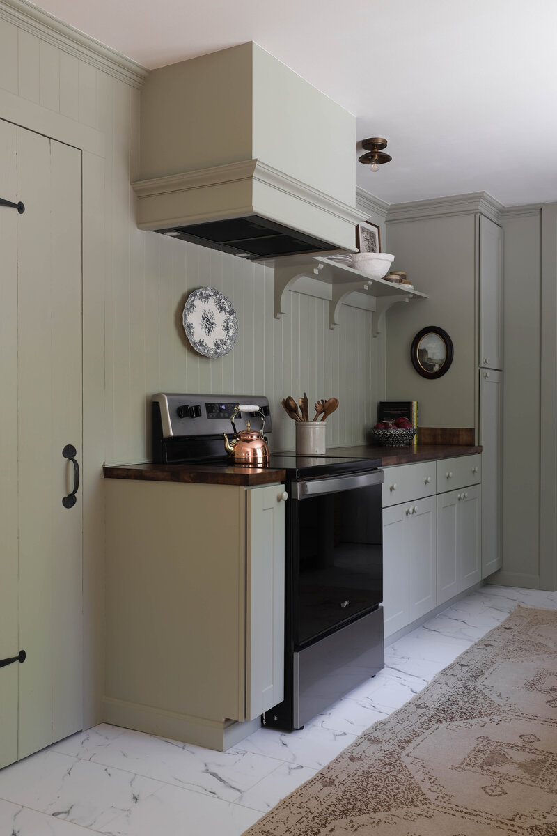 Moody Rustic Laundry Room renovation by Nadine Stay | Dark wood stained walls. Brown painted doors. DIY Ikea Pax hack. DIY mudroom built in cabinet. DIY shaker cabinet doors. DIY inset drawers. Basketweave brick floors.