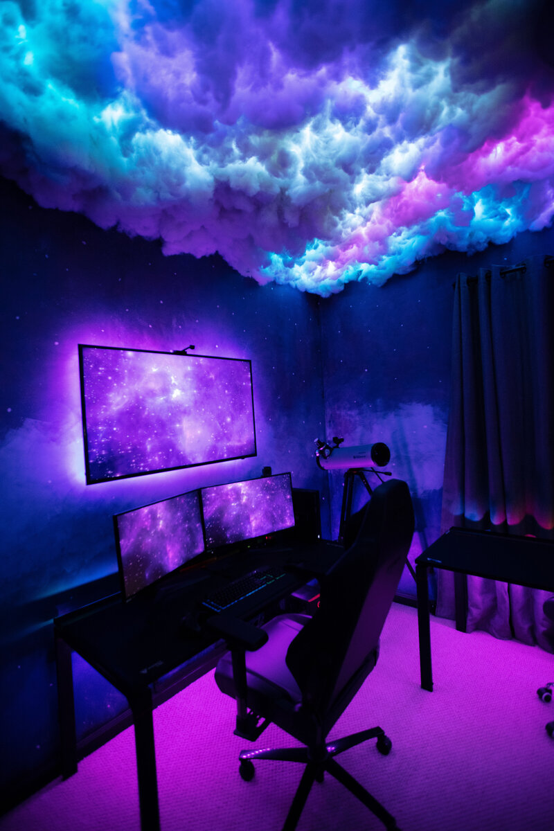 a gaming setup with galaxy decor