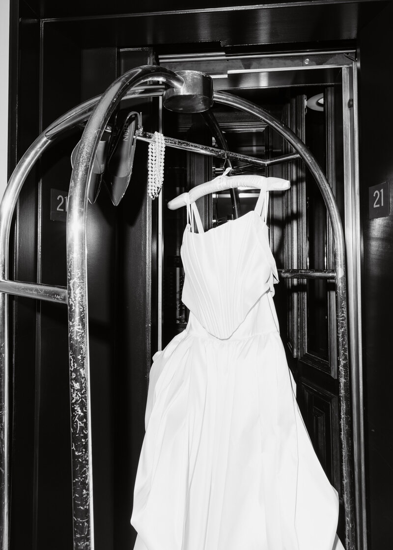 Editorial Portraits of the brides gown in an elevator at the Adolphus Hotel in Dallas, Texas.