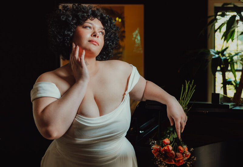 Bride getting ready photos with bouquet and dress, bridal portrait Lansing, Michigan wedding