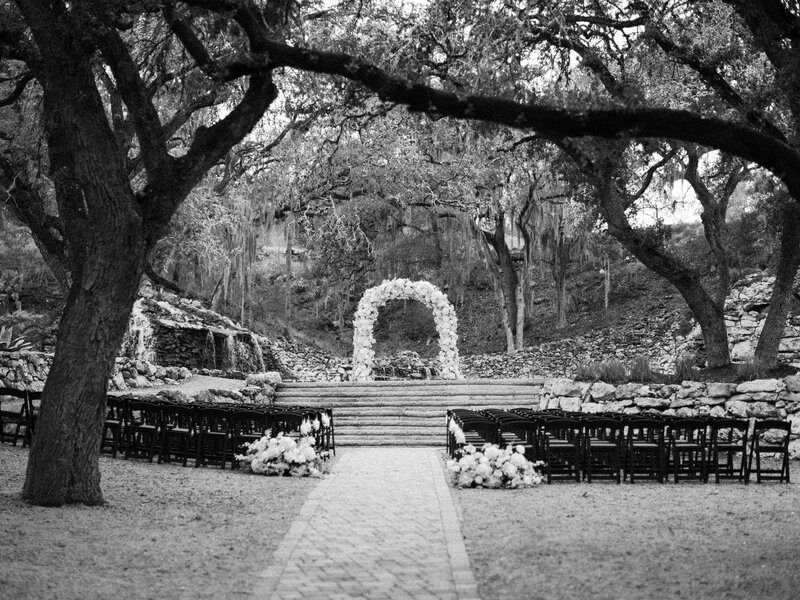 Wedding floral arch for outside ceremony with white roses at Hayes Hollow at Hidden Falls