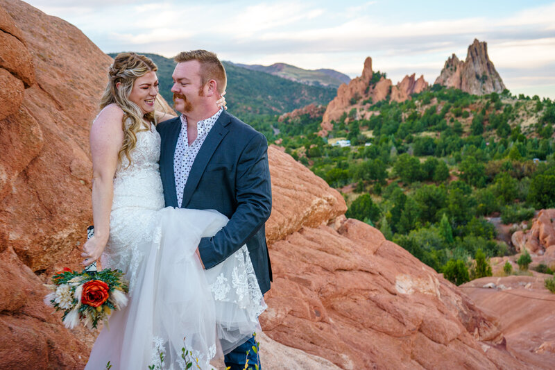 Golden hour elopement portrait with glowing red rocks and natural light at Garden of the Gods