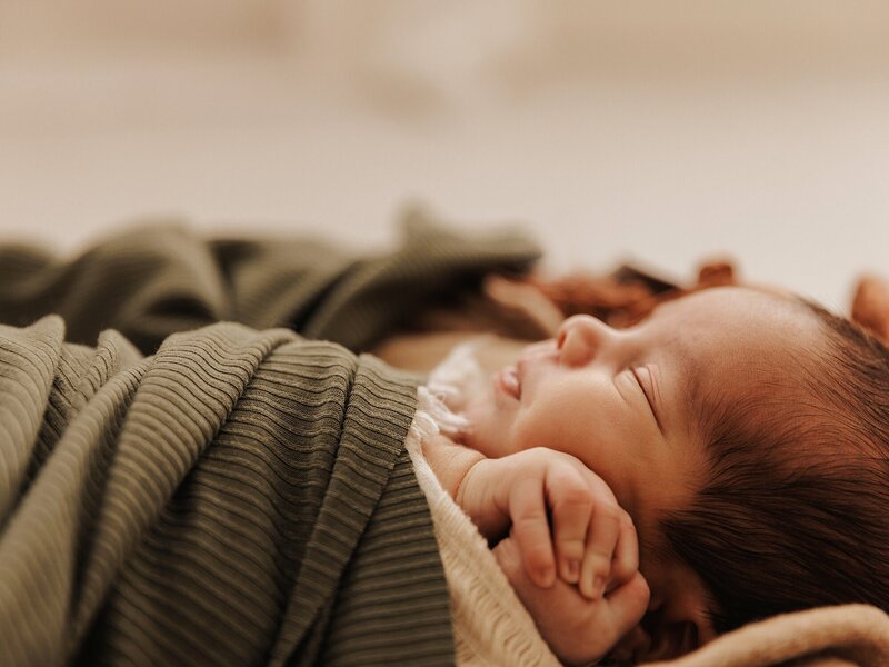 Newborn baby sleeping during a photography session