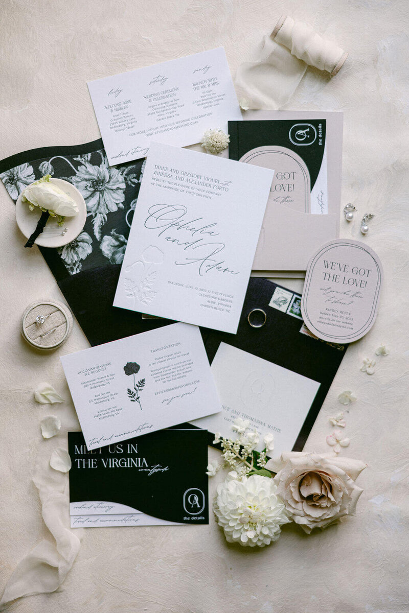 Elegant black and white wedding invitations featuring intricate designs and delicate calligraphy. Photo by Barbara Gomez of Wedding photographer of Washington DC.