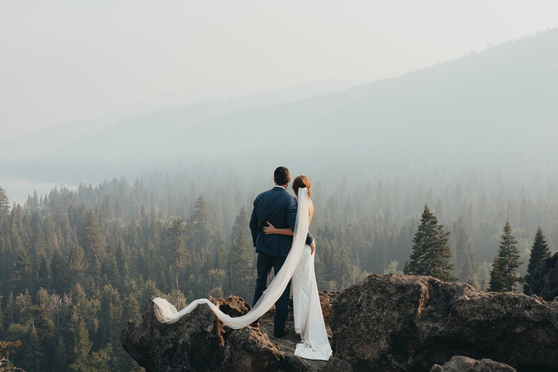 couple looking over lake tahoe at their elopement