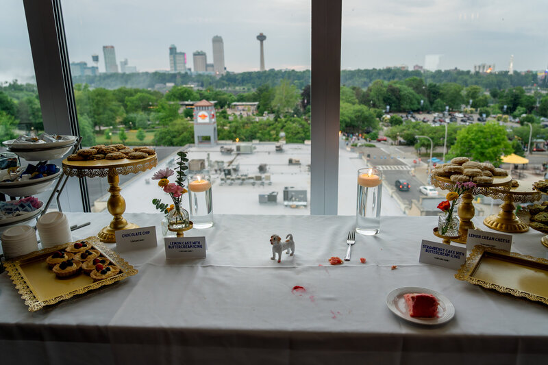 Wide view of reception space with dessert tables and large windows – photographed by wedding photographer Niko Coric – Lumen Clarity Media