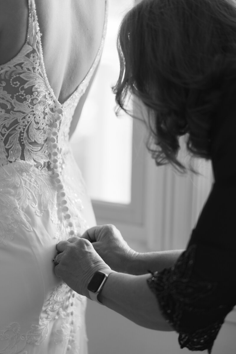 Groom holding bride's hands
