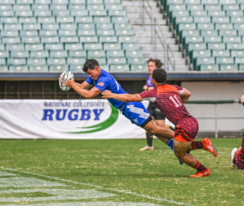 Action Shot of Men's player diving - Zoomie Rugby