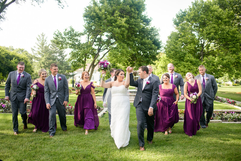 Wedding Party in gray suits and deep purple bridesmaid dresses