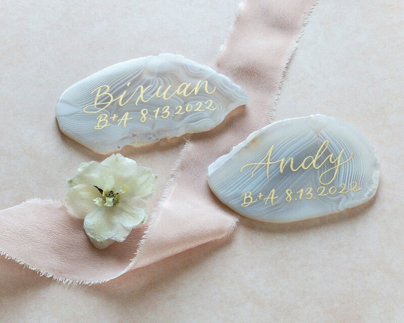 Milky white agate slices with gold calligraphy for wedding place cards and favors