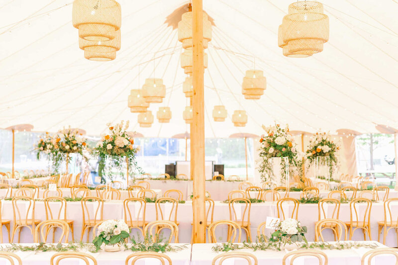 Sperry Tent with wicker lanterns  setup by Dream Weddings, a Wisconsin Wedding Planner..