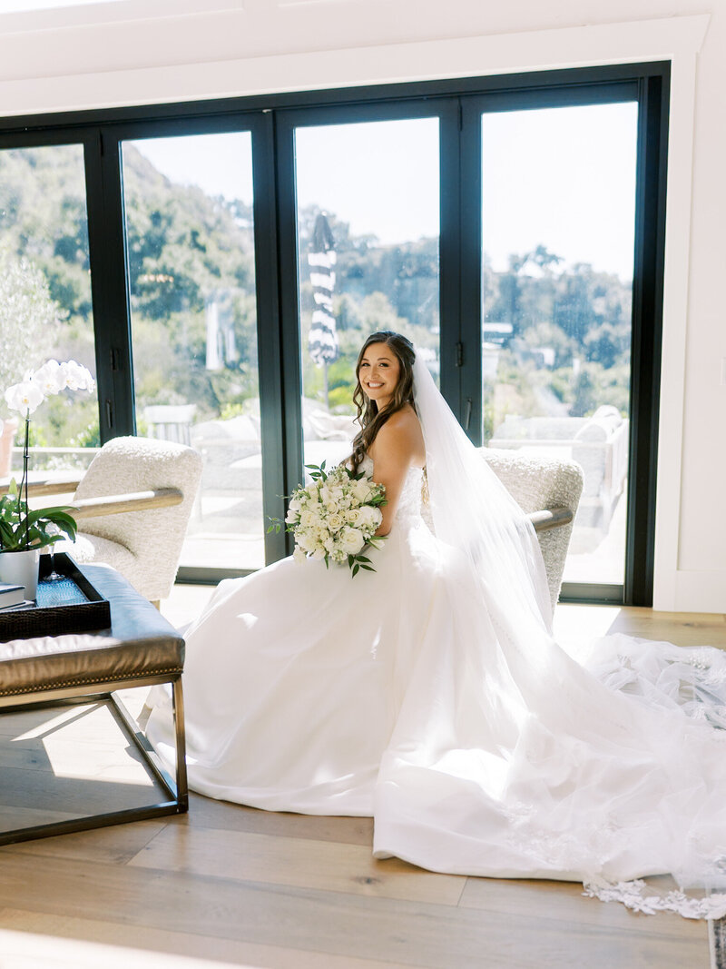 LM201248 editorial portrait of a bride as she wears her designer wedding gown during her luxury wedding in California