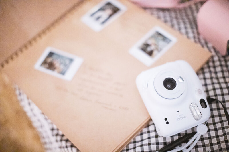 Instax camera and journal at wedding